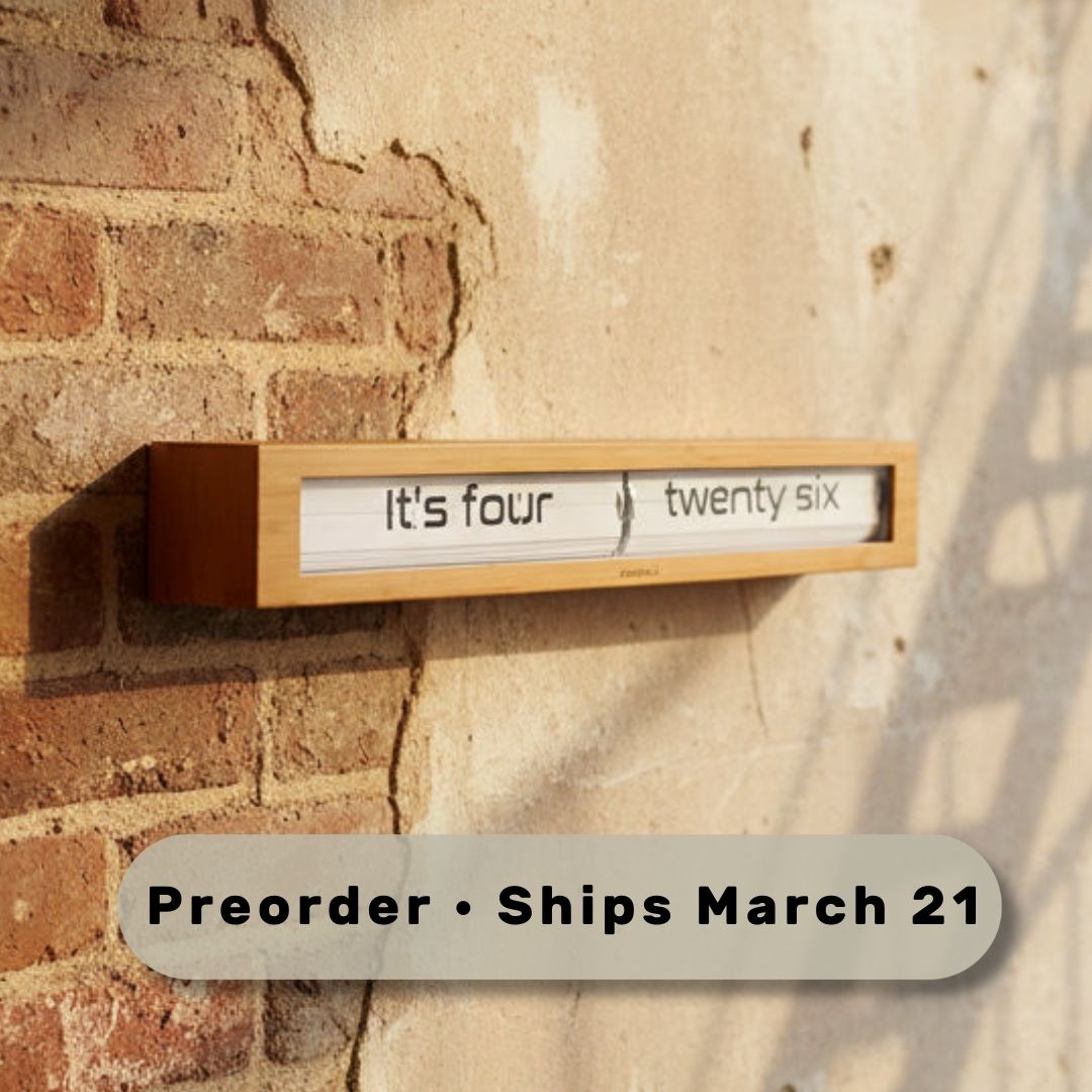 Preorder - Texttime 2.0 Bamboo Text Flip Clock mounted on brick wall showing time in Dutch design, functional design style.