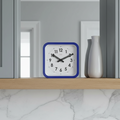 Big Railway Blue Square Kitchen Wall Clock with Dutch Design and Functional Design displayed on wooden shelf in modern kitchen.