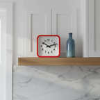 Big Railway Red Square Kitchen Wall Clock with Dutch Design and Functional Design on a wooden shelf in a modern kitchen