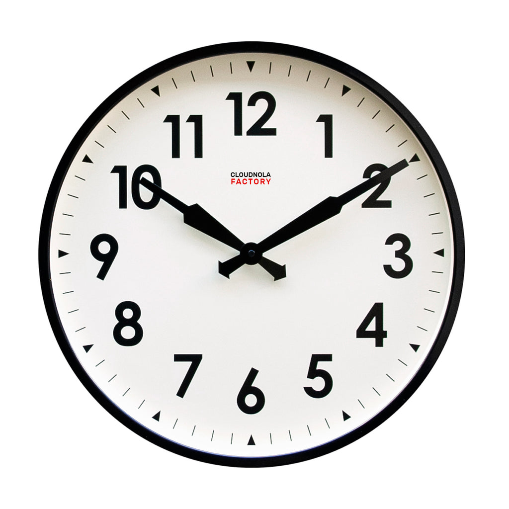 Factory Black XL Clock with bold black numbers and hands on a white face, showcasing Dutch Design and Functional Design principles