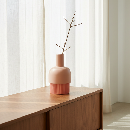 Flip Reversible Ceramic Vase – Coral and Nude Medium on wooden surface with minimalist branch, Dutch Design, Functional Design.