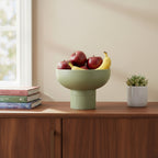 Tip Top Small Ceramic Bowl – Olive Small holding apples and bananas on wooden sideboard in minimalist room Dutch Design Functional Design