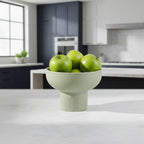 Tip Top Small Ceramic Bowl – Olive Small with green apples on kitchen countertop, showcasing Dutch Design and Functional Design style