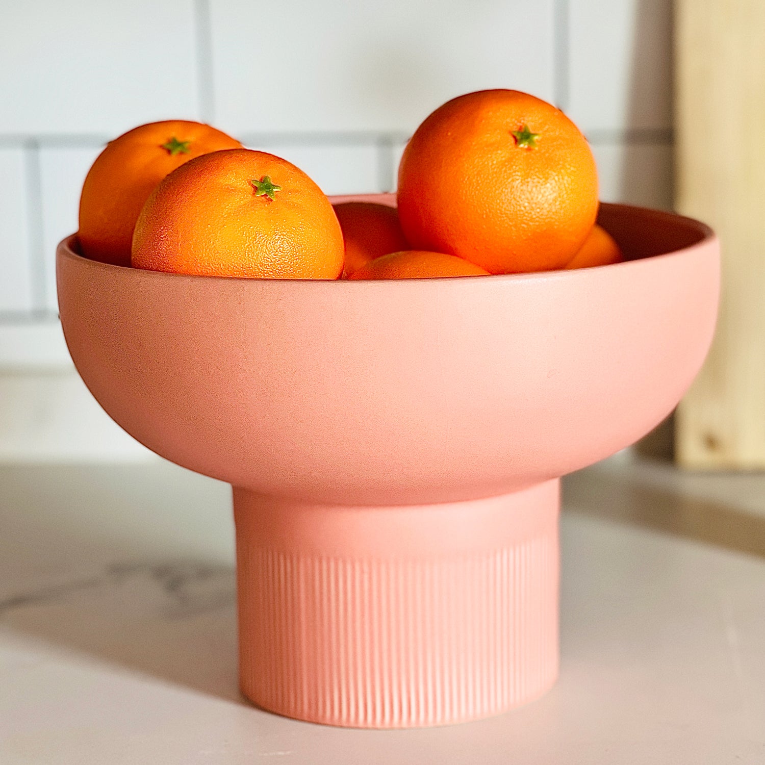 Tip Top XL Ceramic Bowl – Coral XL filled with oranges on a white kitchen counter, Dutch Design, Functional Design