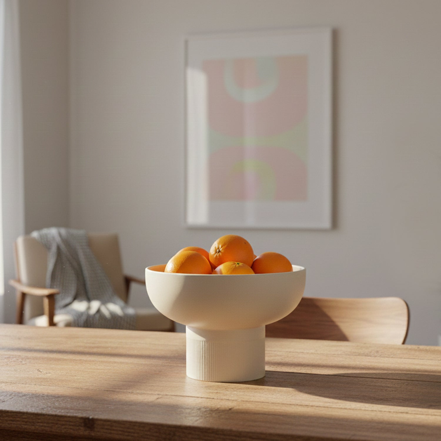 Tip Top XL Ceramic Bowl – Ivory XL holding oranges on wooden table in minimalist room, Dutch Design, Functional Design.