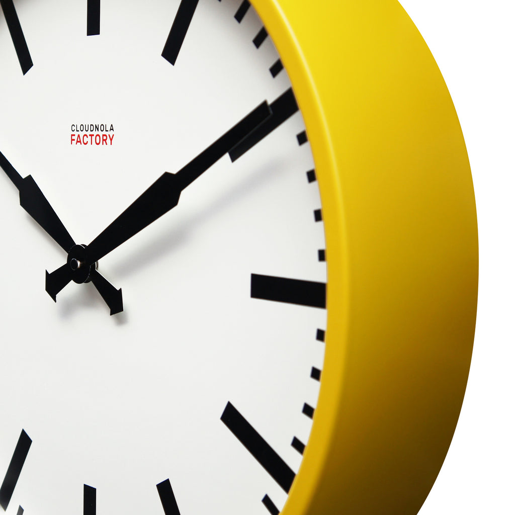 Factory Yellow XL Clock with bold black hands and markers, showcasing Dutch Design and functional design in a modern wall clock.