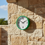 Factory Green Outdoor Clock on textured stone wall, Dutch Design, Functional Design, modern outdoor clock with thermometer and humidity gauges