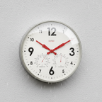 Factory XL Zinc Outdoor Clock with Dutch Design and Functional Design features a weatherproof modern wall clock in rain.